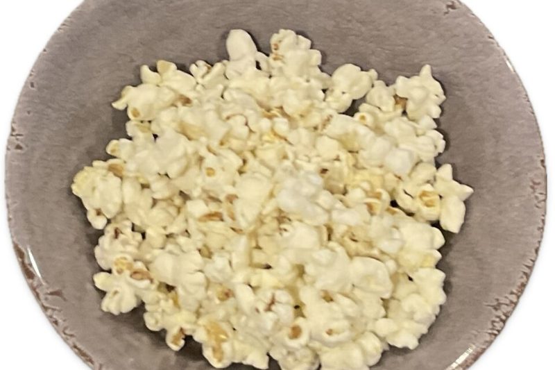 A bowl of popcorn seen from above